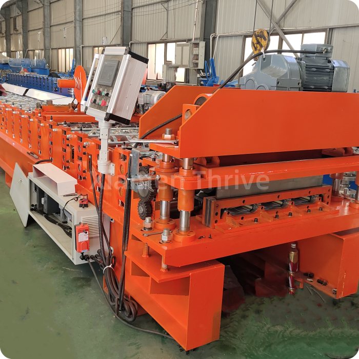 What is the difference between gearbox transmission and chain transmission for a metal roof making machines?